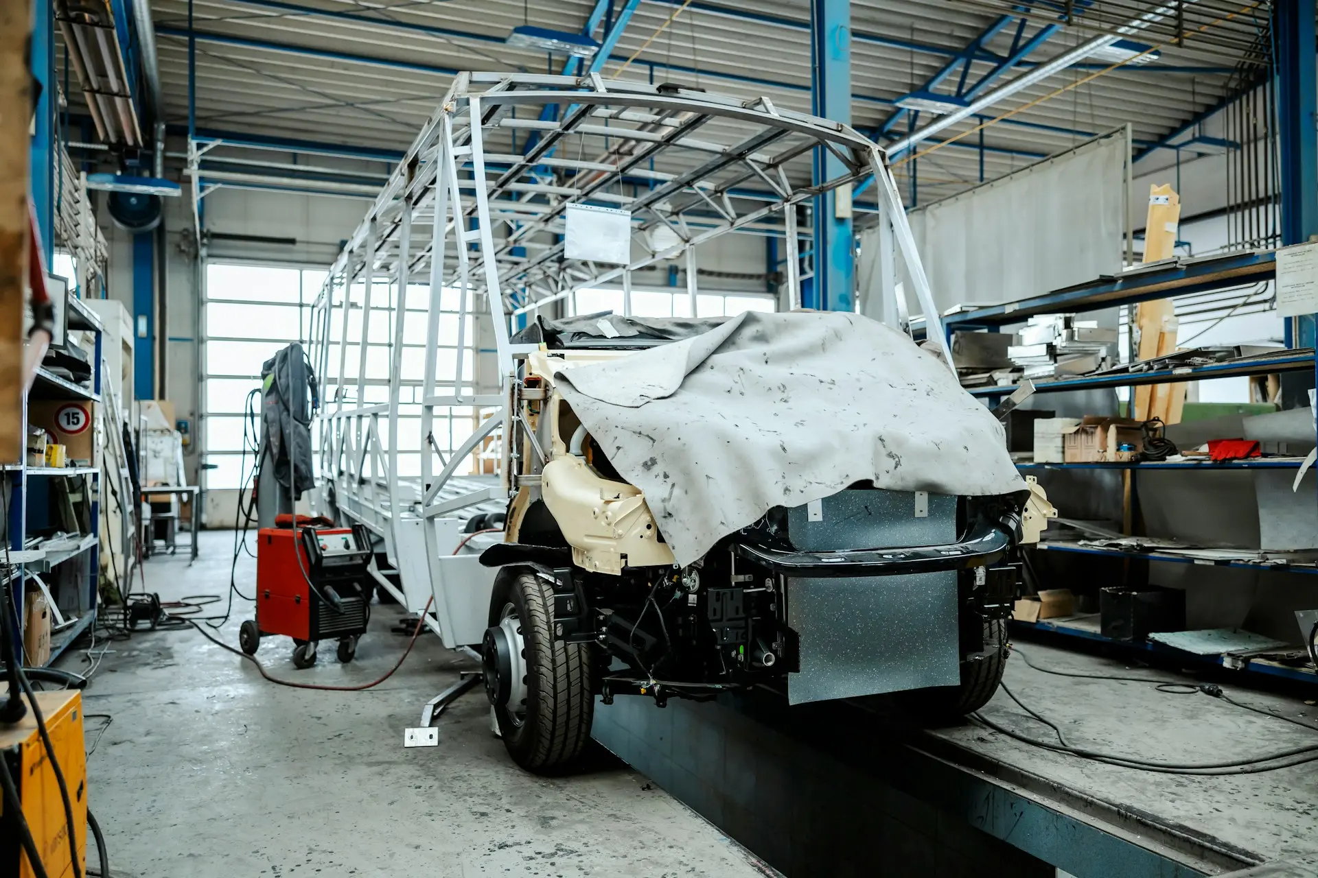 Vehicle being built in a commercial workshop — private business operations